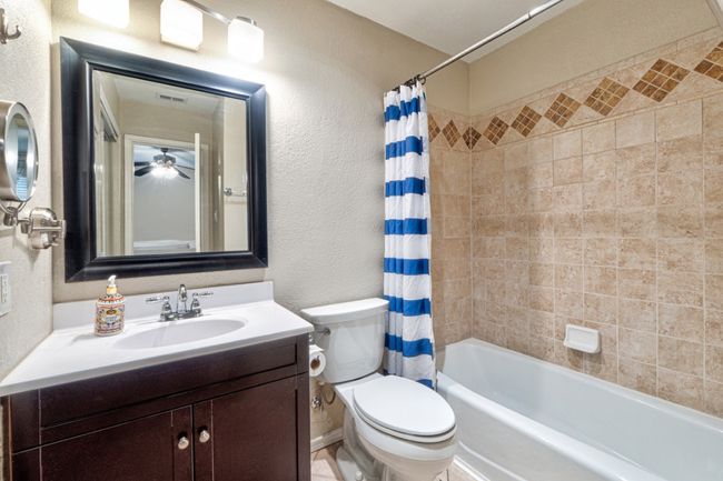Primary bedroom ensuite full bathroom features a second closet and plenty of storage space. | Image 17