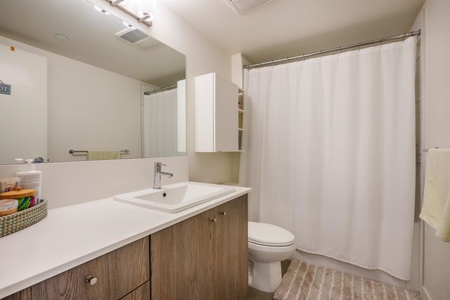 Bathroom featuring toilet and vanity | Image 19