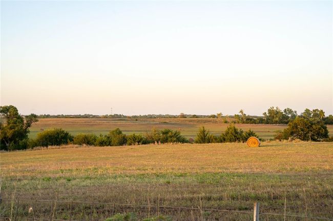 Yard at dusk featuring a rural view | Image 14