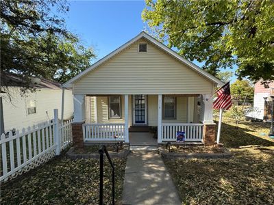 Bungalow-style home featuring covered porch | Image 1