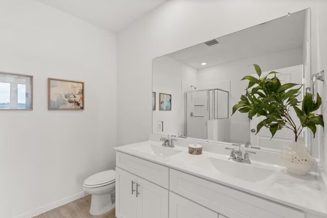 Photo of Pulte model home with same floor plan, not of actual home listed. | Image 8