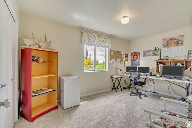 Carpeted office space with baseboards | Image 30