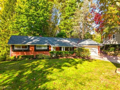 View of front of house featuring a front yard and a garage | Image 2