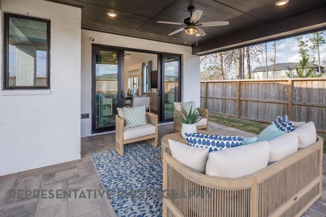 View of patio with outdoor lounge area and a ceiling fan | Image 35