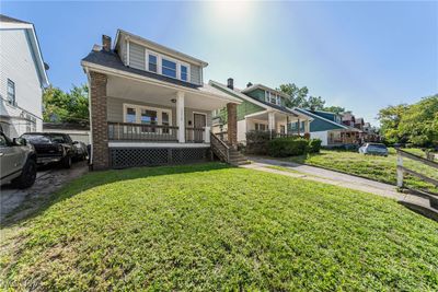 View of front of house with covered porch and a front lawn | Image 2