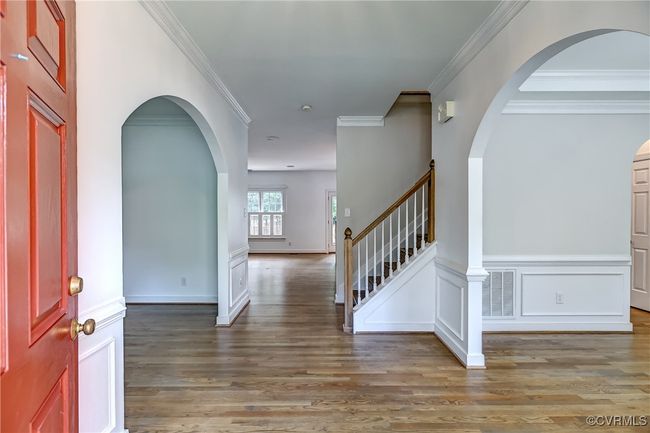 Entry into foyer with archway detail into living & dining room spaces. | Image 4