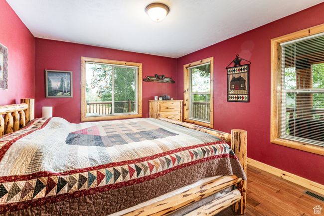 Bedroom featuring wood finished floors and baseboards | Image 17