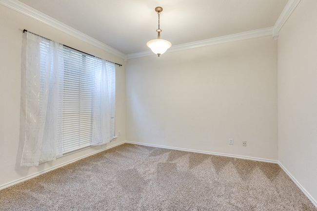 Empty room featuring carpet flooring, crown molding, and baseboards | Image 19