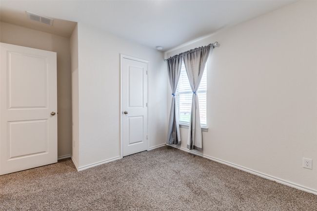 Unfurnished bedroom with baseboards, visible vents, and carpet | Image 17