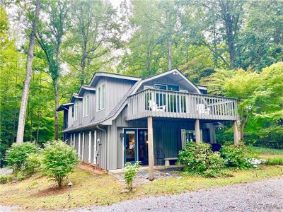 Front of house with a deck and balcony | Image 2