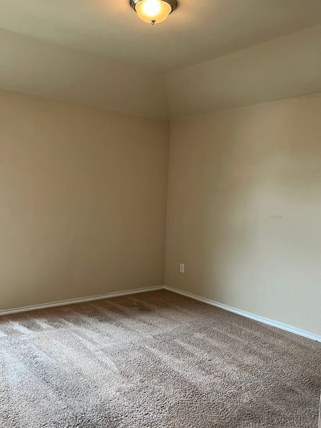 Spare room featuring carpet floors and baseboards | Image 29