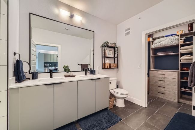 Full bath featuring double vanity and tile patterned floors | Image 14