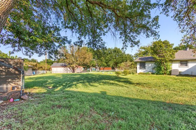 View of yard with central air condition unit and fence | Image 25