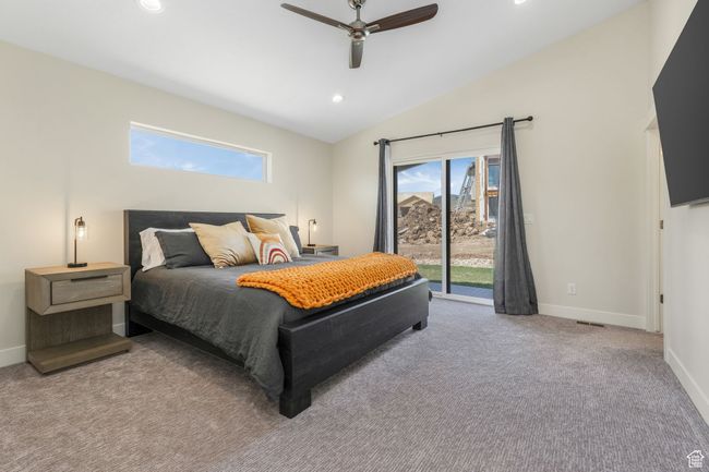 The primary bedroom features a private ensuite and seamless access to a serene outdoor patio. | Image 11