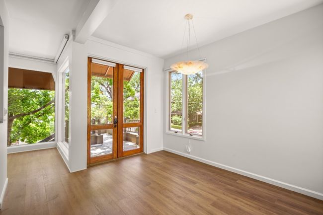 French doors to the front porch- view of the Capital building! Smart Hunter Douglas blinds throughout. | Image 6