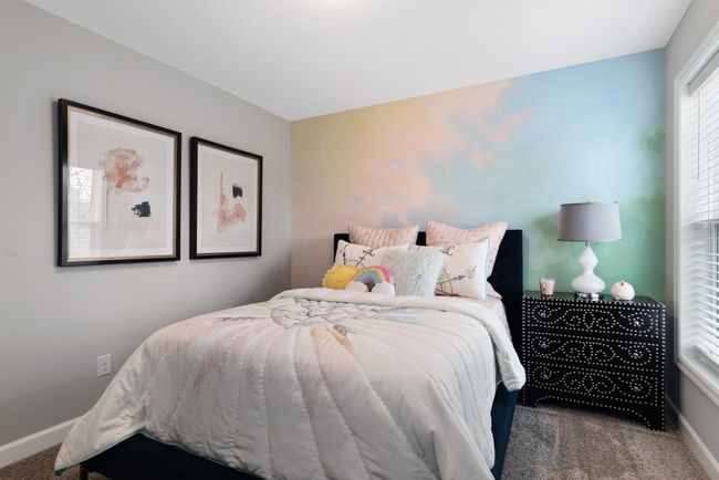 (Photo of decorated model, actual home's finishes will vary) One of three generously sized secondary bedrooms. | Image 17