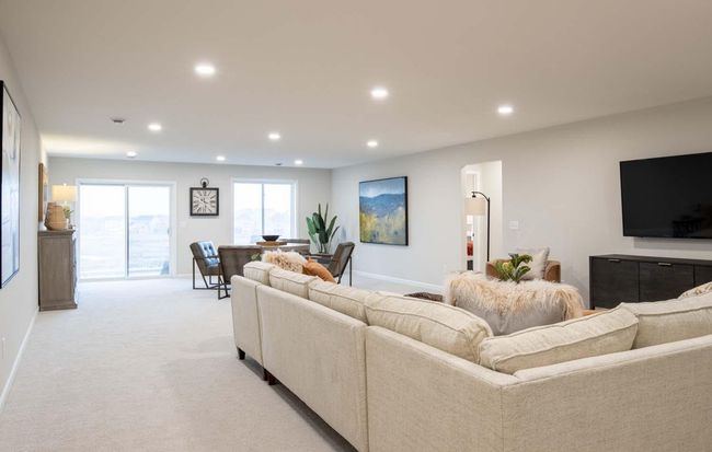 The finished lower level adds an additional living area, which is perfect for guests, entertainment, or relaxation, providing both privacy and convenience. Photos are from previously built home; options and features will vary. | Image 21