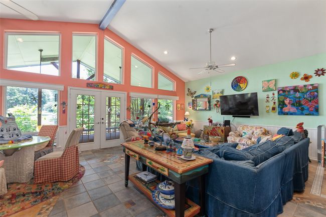 Abundant light with French Door to back deck. Room for another dining table and a piano | Image 16