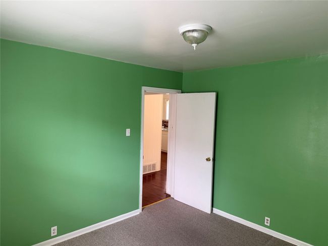 Unfurnished bedroom with carpet and baseboards | Image 14