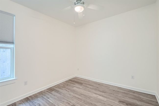 The downstairs bedroom makes for a great home office for guest suite! | Image 12