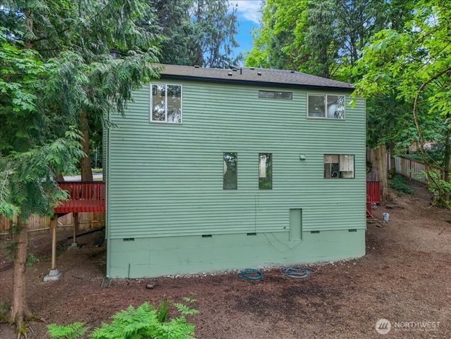 Back of house. bottom door leads to storage space the length of the house | Image 40