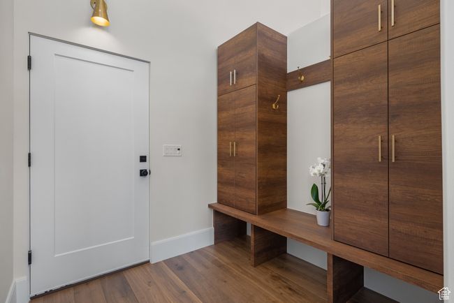 Mudroom with baseboards and wood finished floors | Image 36