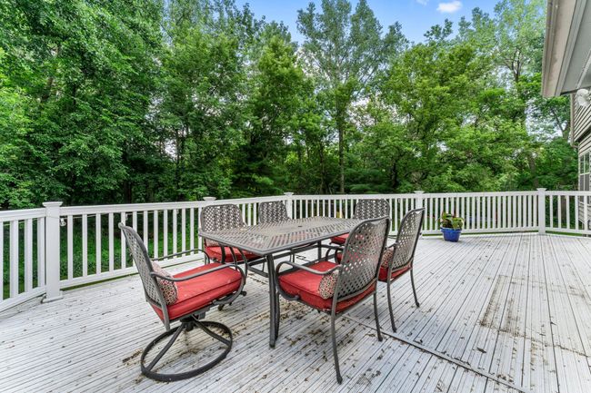 The expansive 26x12 maintenance-free back deck offers the perfect space for summer barbecues, outdoor dining, or simply soaking in the peaceful surroundings. | Image 20