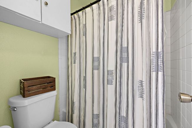 Primary bathroom water closet with shower/tub | Image 14