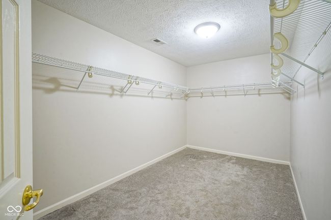 walk in closet featuring carpet | Image 28