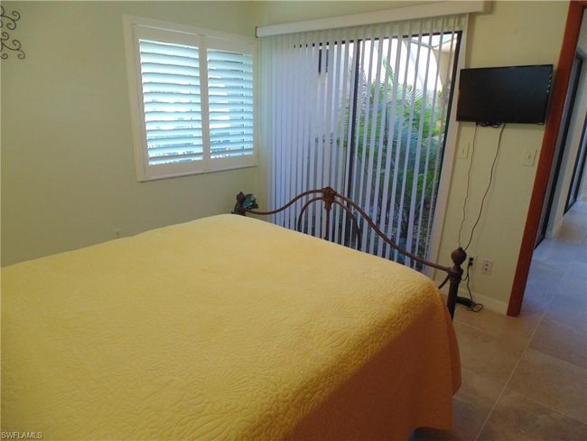 Bedroom featuring tile patterned floors and baseboards | Image 24
