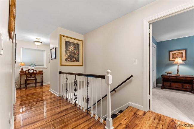 Staircase featuring baseboards and wood finished floors | Image 33