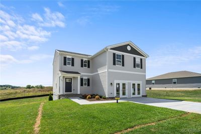 Front of property with a front lawn and french doors | Image 2