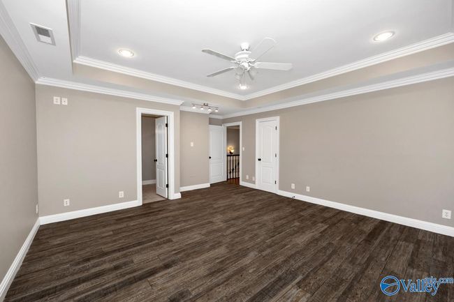 Crown molding, trey ceiling, recessed lighting, ceiling fan, Tile flooring | Image 35