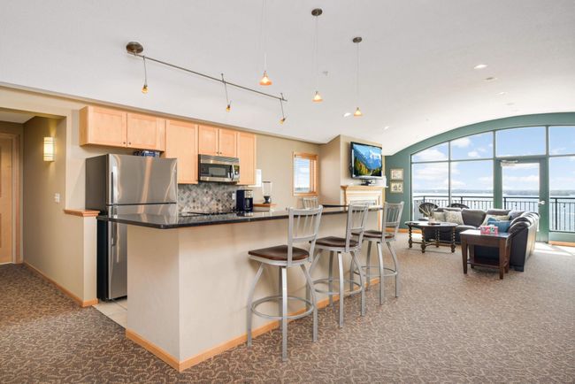 The large 5th-floor party room has a kitchen, a TV area, and a stunning southern view of Spring Park Bay. | Image 21