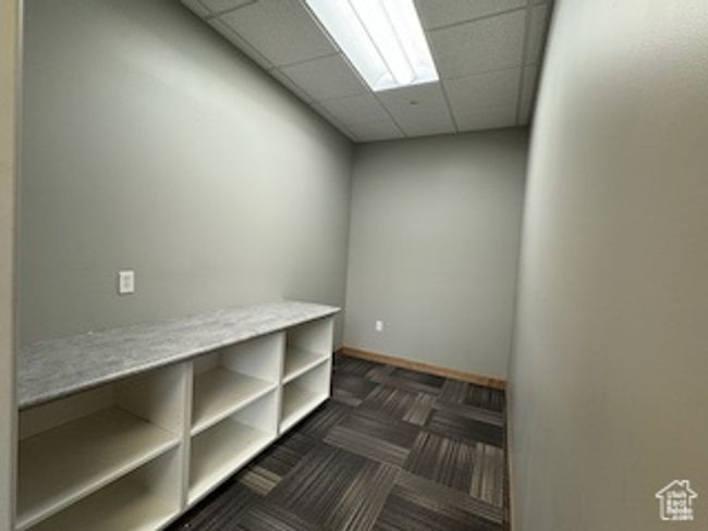 Spare room featuring a paneled ceiling | Image 42