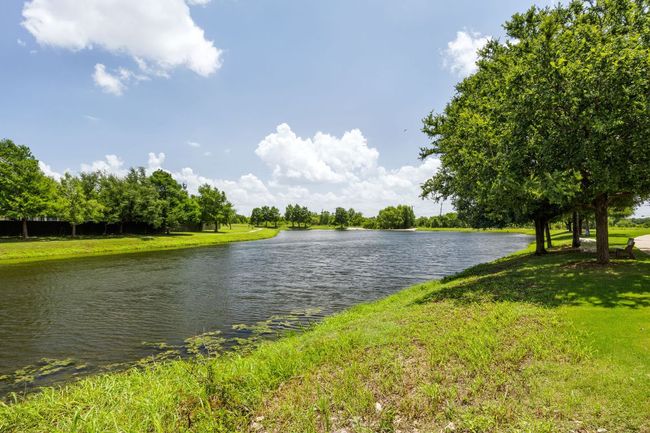 walking path around a small lake within 1 minute walk of house | Image 35