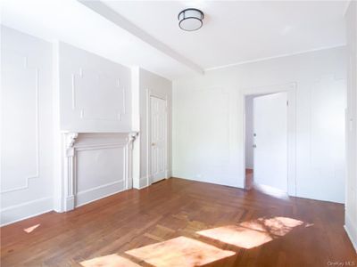 Unfurnished room featuring dark hardwood / wood-style floors | Image 1