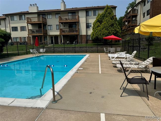 Community pool featuring a patio | Image 24