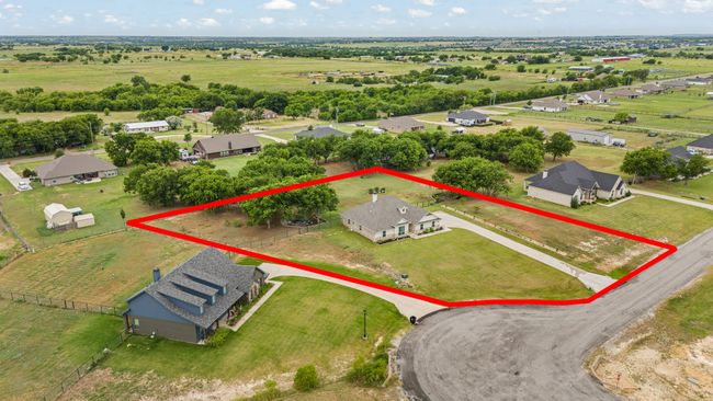 View of rural area featuring property parcel outlined and nearby suburban area | Image 39