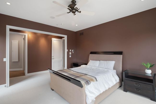 2nd level - Primary suite with private balcony and walk-in closet | Image 24