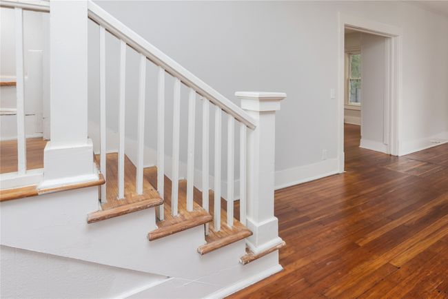 Staircase with wood-type flooring and baseboards | Image 30