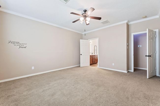 Primary bedroom with ceiling fan | Image 24