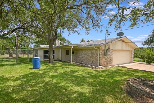 Side entry 2 car garage & the back of this great home. | Image 28