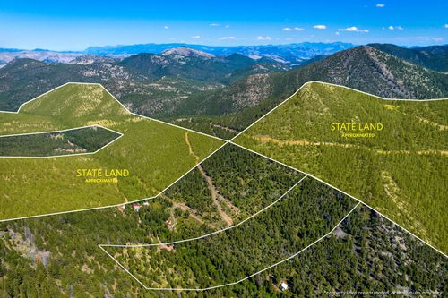 4253 Woods Creek Rd, Wolf Creek, MT, 59648-8543 | Card Image