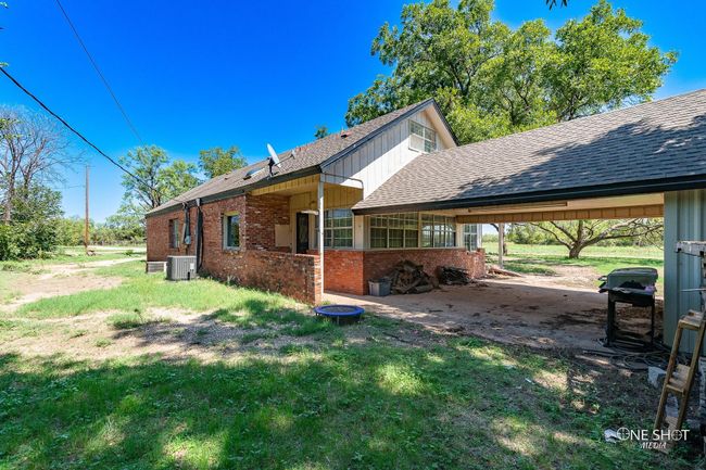 View of side of property featuring cooling unit and a carport | Image 33