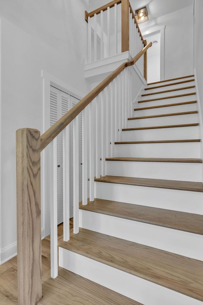 New wooden stairs and railing to the upstairs. | Image 6