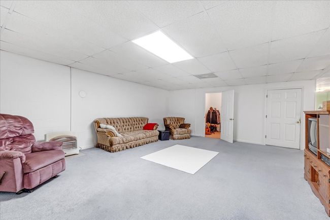 Huge living room in the basement | Image 33