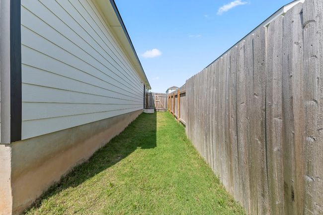 View of fenced backyard | Image 30