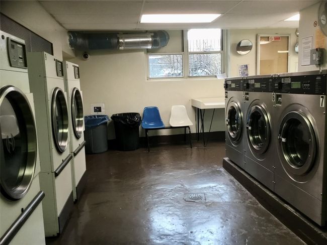 Clothes washing area with independent washer and dryer | Image 17