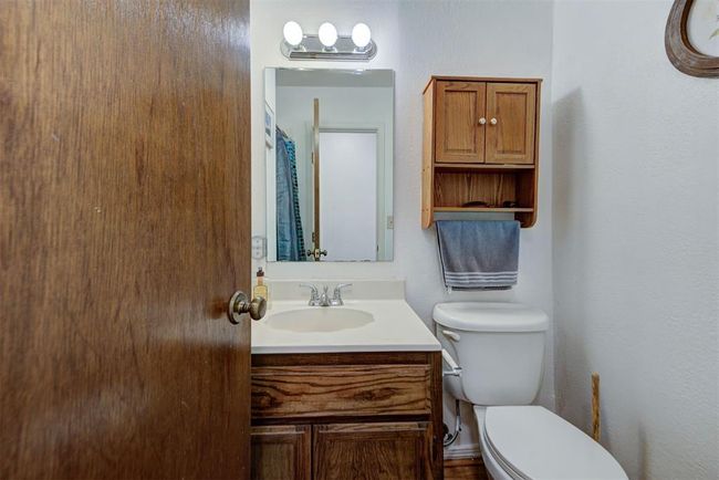 Bathroom with toilet and vanity | Image 13